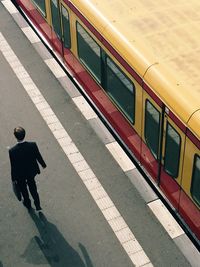 Full length of woman standing by railing