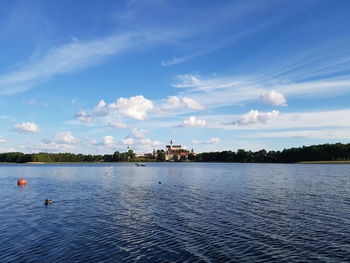 View of lake against cloudy sky