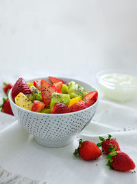 Close-up of strawberries in bowl on table