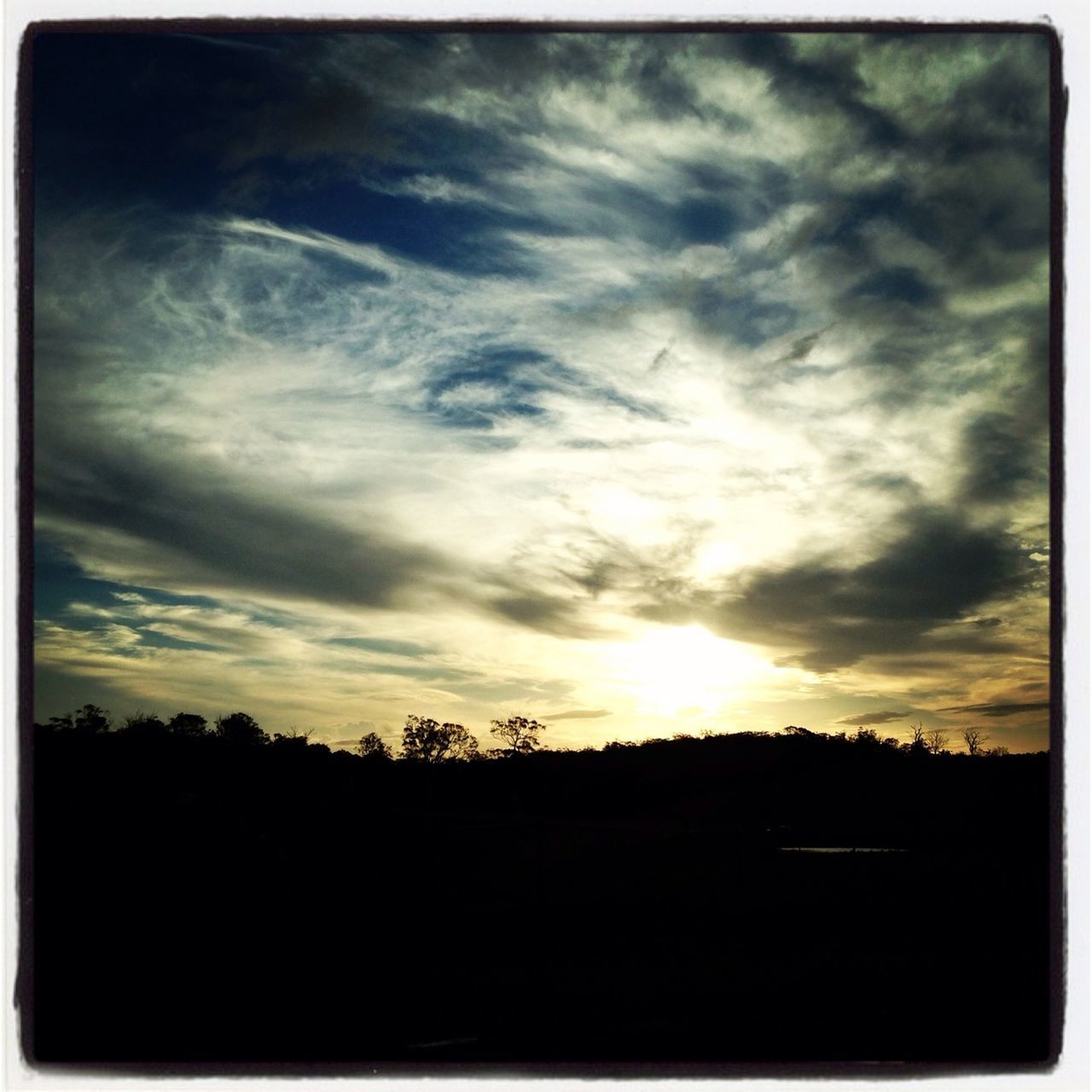 sunset, silhouette, sky, scenics, tranquil scene, beauty in nature, tranquility, cloud - sky, landscape, nature, dark, cloud, cloudy, idyllic, dramatic sky, sun, transfer print, orange color, moody sky, outdoors