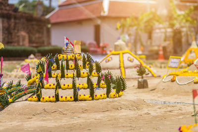 Yellow flowers on building outside temple