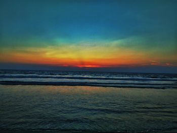 Scenic view of sea against sky at sunset