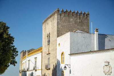 Low angle view of old building against clear sky