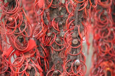 Full frame shot of red bangles on wall