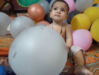 Full length of boy playing with ball at home