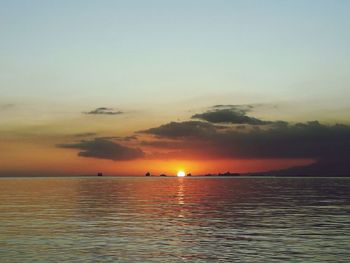 Scenic view of sea against sky at sunset