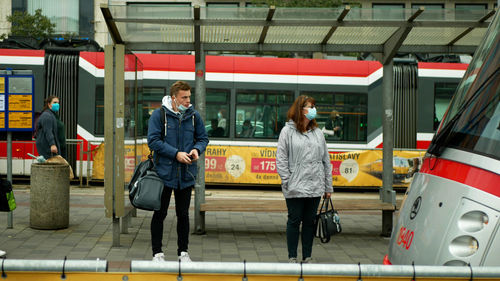 Full length of people on bus in city