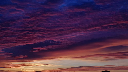 Low angle view of dramatic sky during sunset