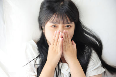 Close-up of young woman looking away