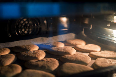 Christmas cookies baking in the oven. christmas baking. gingerbread biscuits on baking tray.