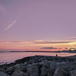 Scenic view of sea against sky during sunset