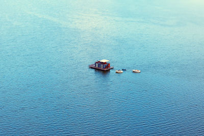 High angle view of boat sailing in sea