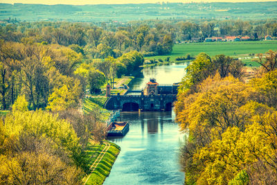 High angle view of yellow bridge over river during autumn