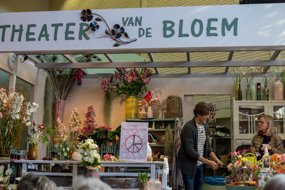 People at market stall