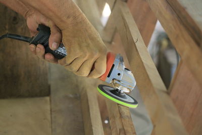 Close-up of man working on wood