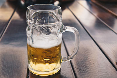 Close-up of beer glass on table