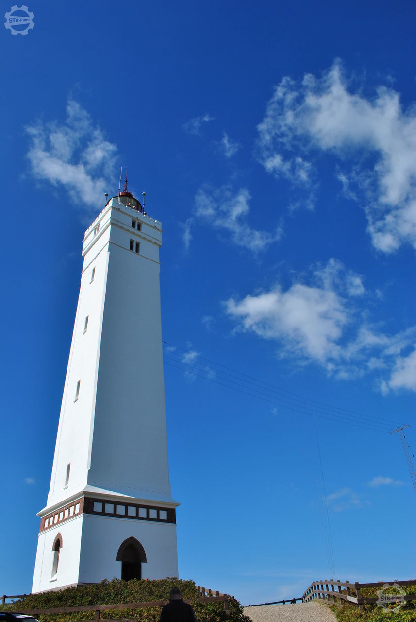 LOW ANGLE VIEW OF LIGHTHOUSE AGAINST BUILDING