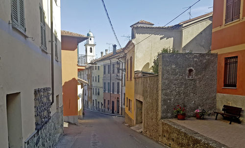 Narrow street amidst buildings in town