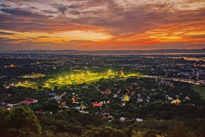 High angle view of city against sky during sunset