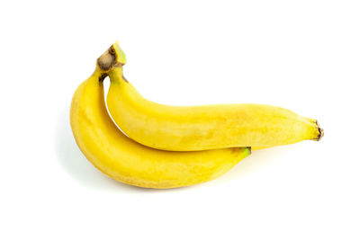 Close-up of yellow fruit against white background