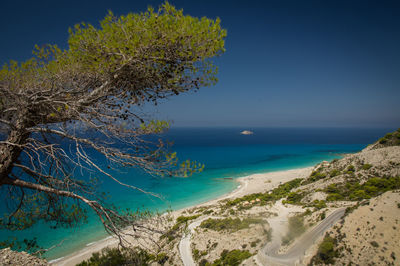 Scenic view of sea against clear blue sky
