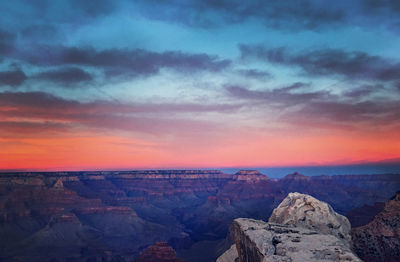 Scenic view of landscape against cloudy sky