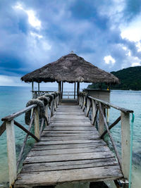 Pier over sea against sky