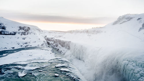 Scenic view of snowcapped mountains during winter