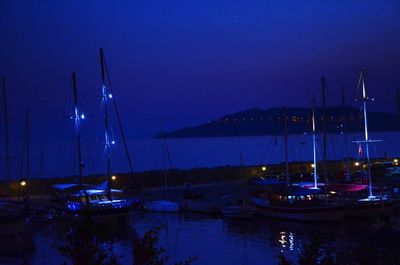 Boats moored at harbor