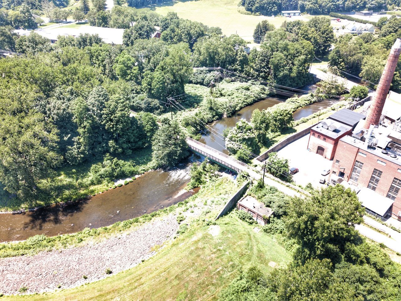 HIGH ANGLE VIEW OF TREES BY BUILDINGS