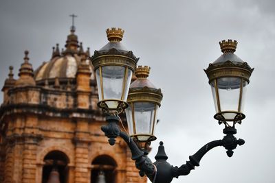 Low angle view of street light against sky