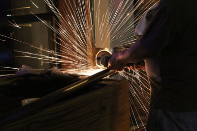 Low angle view of man working at factory