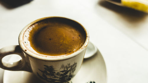 High angle view of coffee cup on table