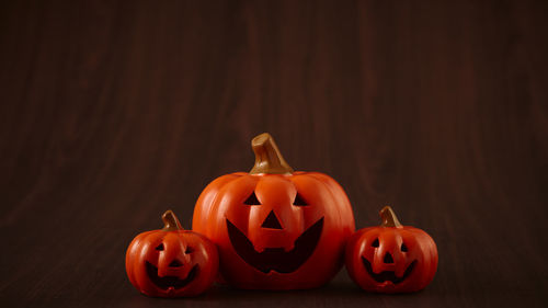 View of pumpkins against black background