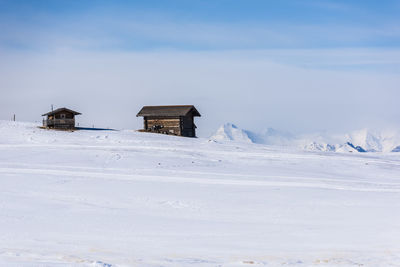 Dream huts on the alpe di siusi. in the white. dolomites, italy