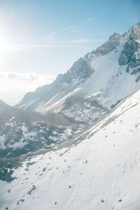 Scenic view of snowcapped mountains against sky