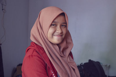 Portrait of smiling young woman at home