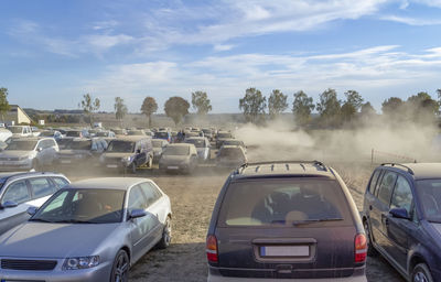 Cars on road against sky