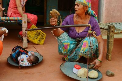 Group of people holding food on table