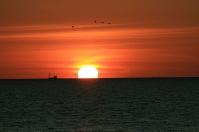 Scenic view of sea at sunset