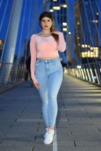 Portrait of young woman standing outdoors