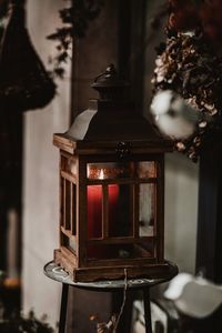 Close-up of illuminated lantern on table