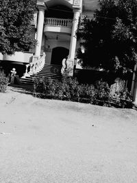 Low angle view of staircase by building in city