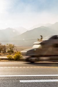 Blurred motion of truck on road