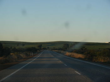 Empty road along landscape