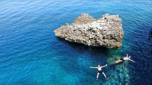 High angle view of woman swimming in sea