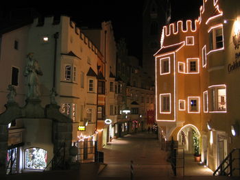 Buildings in city at night