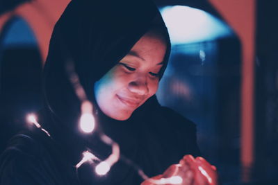 Close-up of young woman smiling