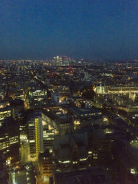 High angle view of illuminated buildings in city at night