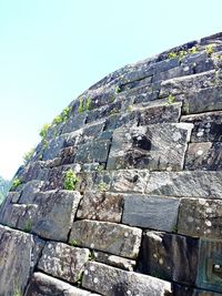 Low angle view of stone wall